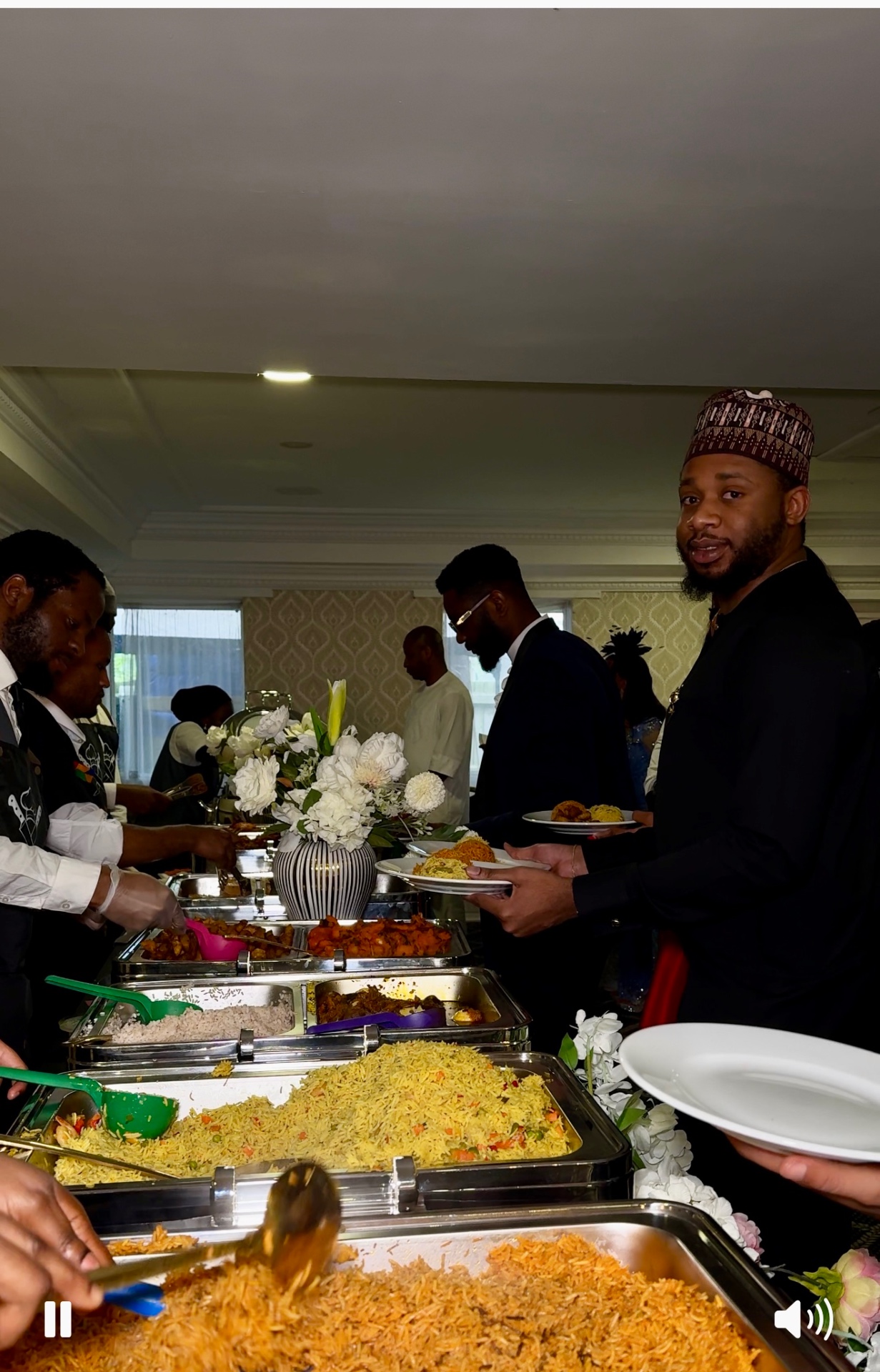 Wedding guests and buffet service during a live catering moment