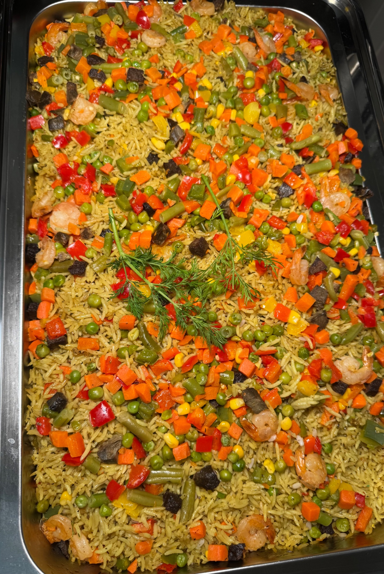 Seafood rice tray with peppers, vegetables and herbs